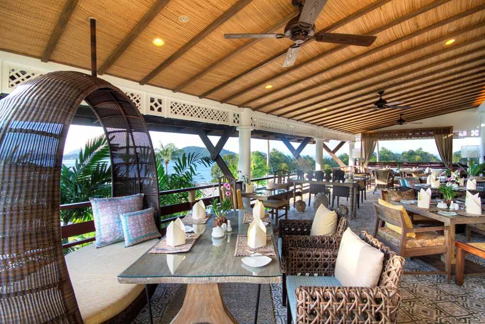 Elegant outdoor dining area at Cape Panwa in Phuket, Thailand.