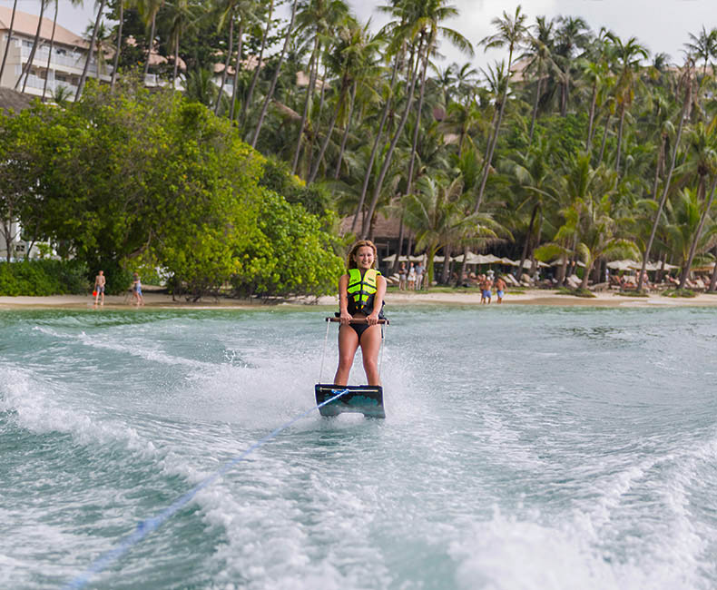 Water ski behind a single or dual-engine speed boat.